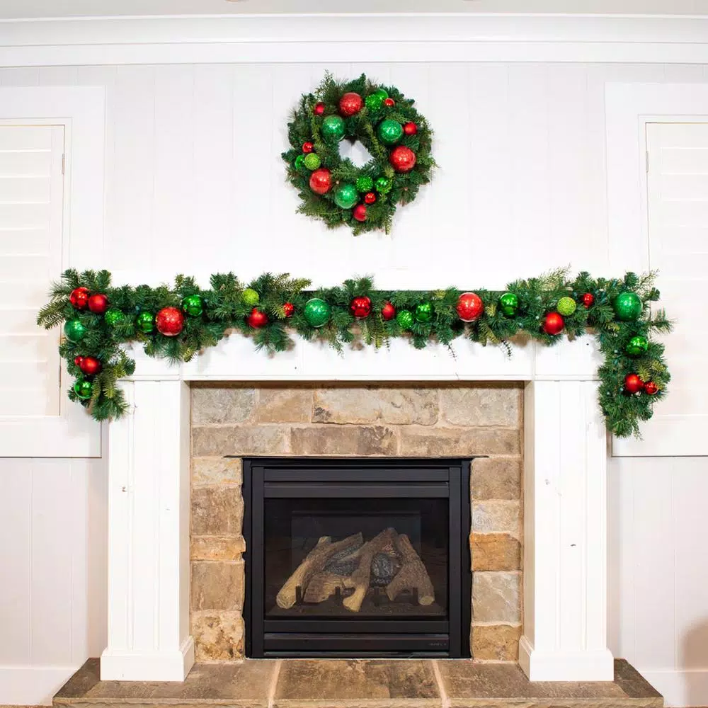Village Lighting Company 24 in. Red and Green Christmas Cheer Artificial Pine Wreath with Ornaments