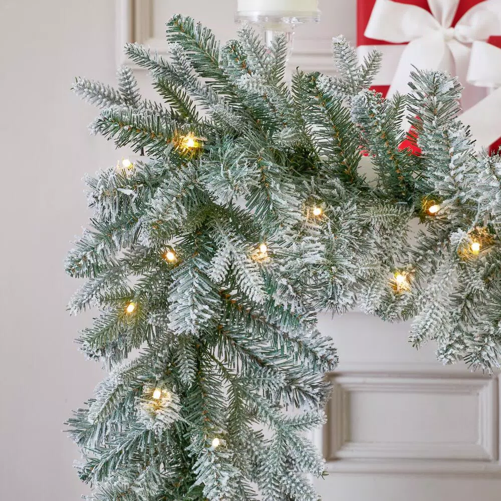 Home Accents Holiday 9 ft. Pre-Lit Flocked Frasier Fir LED Garland with Timer