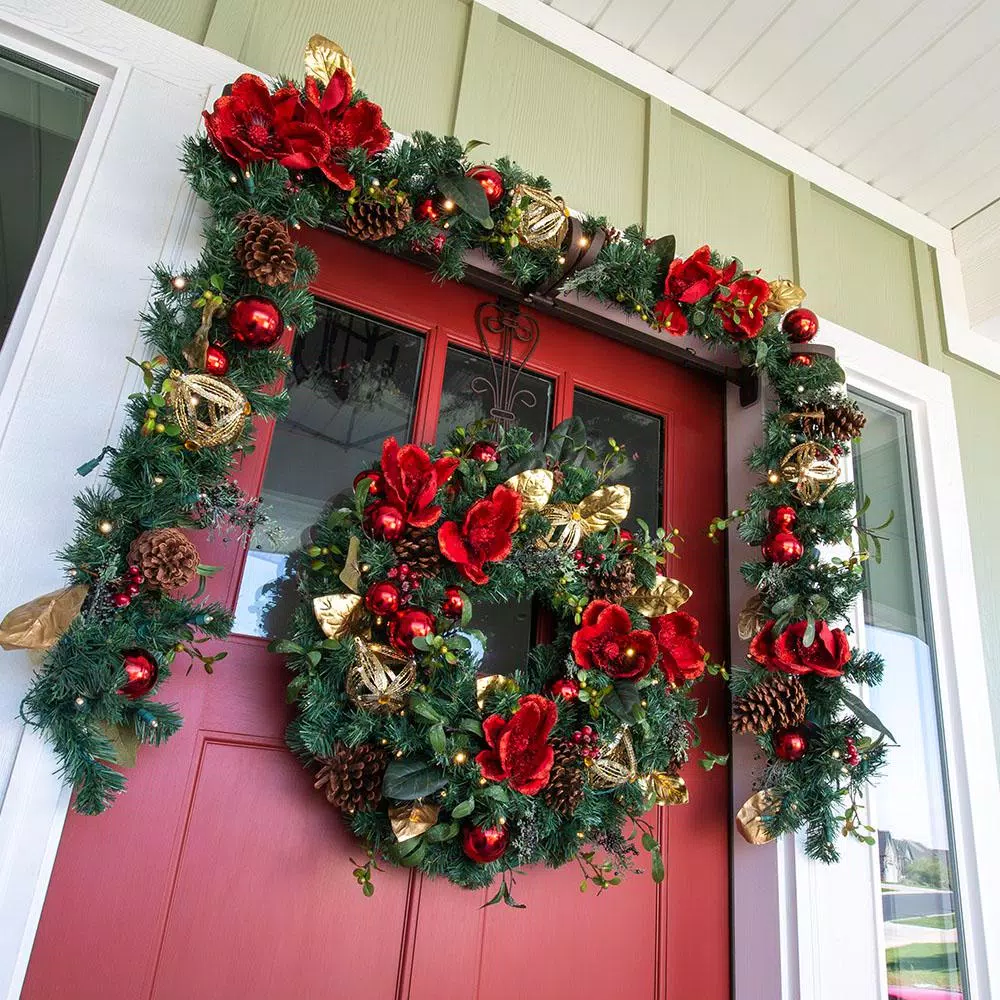 Village Lighting Company 9 ft. Pre-Lit Red Magnolia Christmas Garland with 100 LED Mini Lights