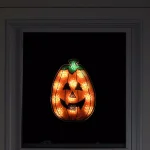 Northlight 12 in. Orange Holographic Lighted Pumpkin Halloween Window Silhouette Decoration thumbnail 2