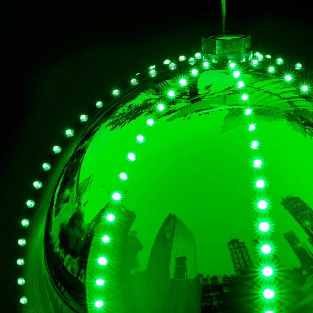 Alpine Corporation 13 in. Green Hanging Christmas Ball Ornament with 240 Chasing LED Lights