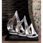 LITTON LANE 9 in. Stylized Sailboat Decorative Sculpture - Polished Silver Aluminum on Black Wood Base thumbnail 1