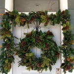 Village Lighting Company 9 ft. Pre-Lit LED Magnolia Leaf Garland with Pinecones and Warm White Lights thumbnail 5