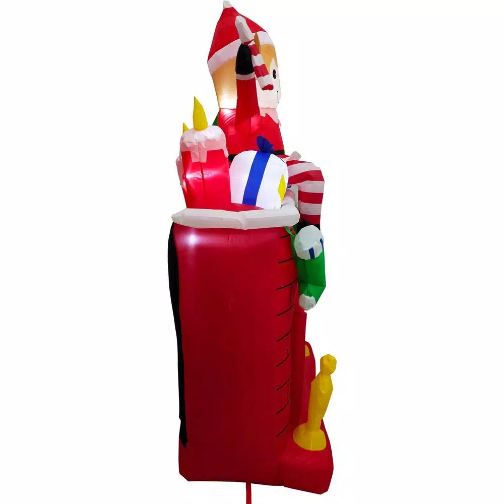 Fraser Hill Farm 6.5 ft. Pre-Lit Elf Sitting on Fireplace Christmas Inflatable