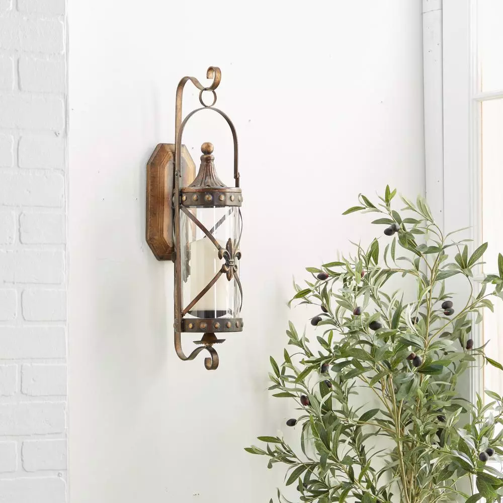 LITTON LANE Old World Riveted Burnished Bronze Iron Candle Sconce with Fleur-de-lis Motif