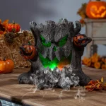 Gerson 12.4 in. Electric Smoking Haunted Tree Stump Halloween Tabletop Decor with Color Changing LED Lights thumbnail 1