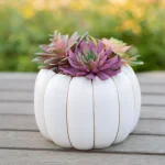 Flora Bunda 8 in. Fall Harvest Artificial Succulent Arrangement in Cream Pumpkin Pot with Gold Accents thumbnail 3