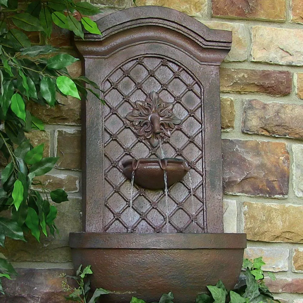 Sunnydaze Decor Rosette Resin Weathered Iron Solar Outdoor Wall Fountain with Battery Backup