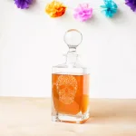 Cathy's Concepts 10 in. Sugar Skull 32 oz. Square Whiskey Decanter with Glass Domed Topper thumbnail 1