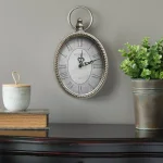 Stratton Home Decor Antique Silver Oval Wall Clock with Roman Numerals thumbnail 1
