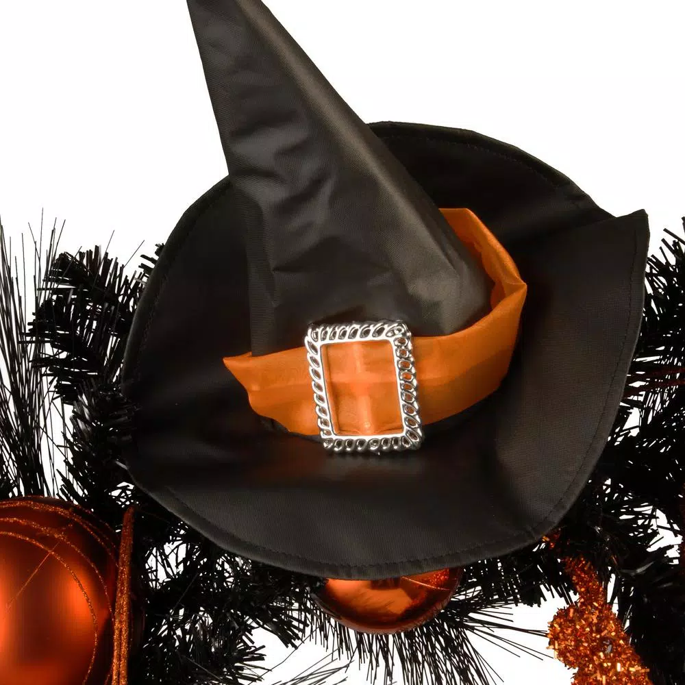National Tree Company 24 in. Halloween Witch Wreath with Witch Hat, Striped Legs, and Glittered Broom