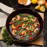 Bayou Classic 14 in. Pre-Seasoned Cast Iron Skillet with Pour Spouts and Helper Handle, Black thumbnail 6