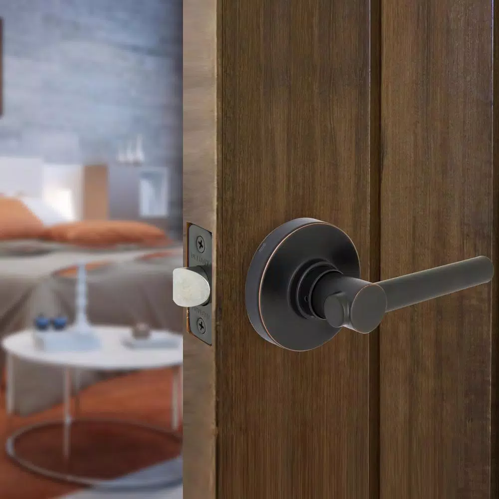 Defiant Highland Aged Bronze Passage Door Lever with Round Rose