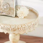 LITTON LANE 10 in. Round Whitewashed and Rust Brown Iron Cake Stand with Pierced Floral Bunting thumbnail 6