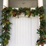 Village Lighting Company 9 ft. Pre-Lit LED Magnolia Leaf Garland with Pinecones and Warm White Lights thumbnail 4
