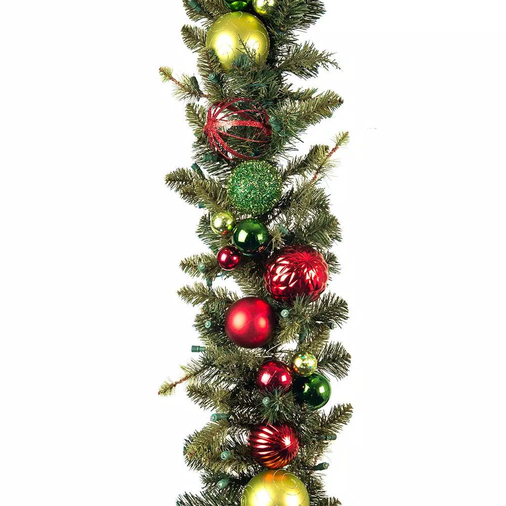 Village Lighting Company 9 ft. Pre-Lit LED Festive Holiday Pine Garland with Red and Green Ornaments