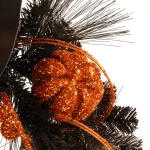 National Tree Company 24 in. Halloween Witch Wreath with Witch Hat, Striped Legs, and Glittered Broom thumbnail 3