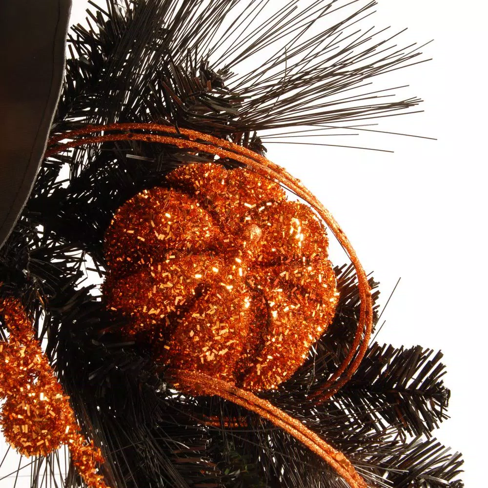 National Tree Company 24 in. Halloween Witch Wreath with Witch Hat, Striped Legs, and Glittered Broom
