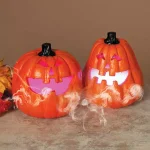 Gerson 9.25 in. Electric Smoking Jack-O-Lanterns with Color Changing LED Effect, Set of 2 thumbnail 2