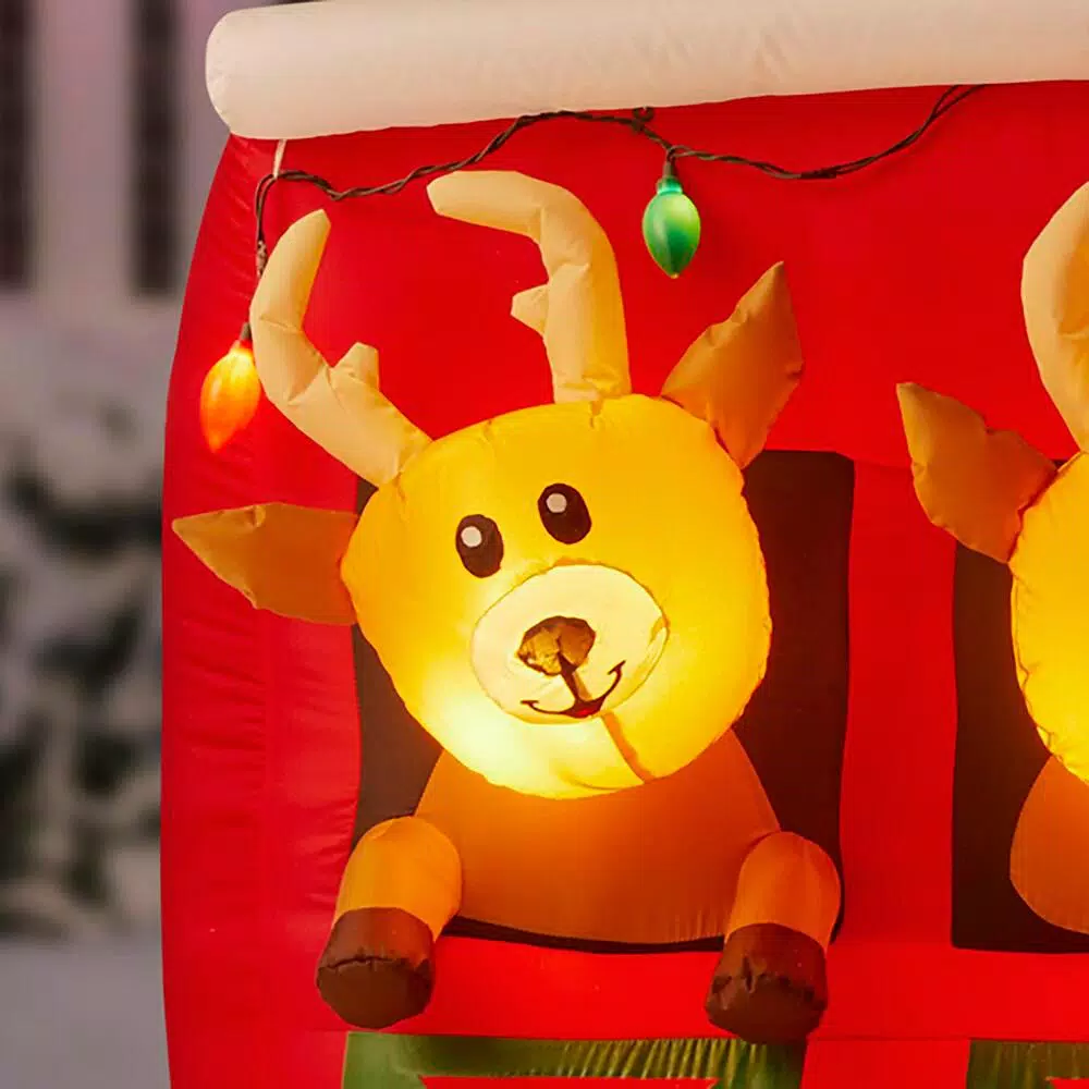Home Accents Holiday 9 ft LED Inflatable Santa's Stable with Reindeer Holiday Decor