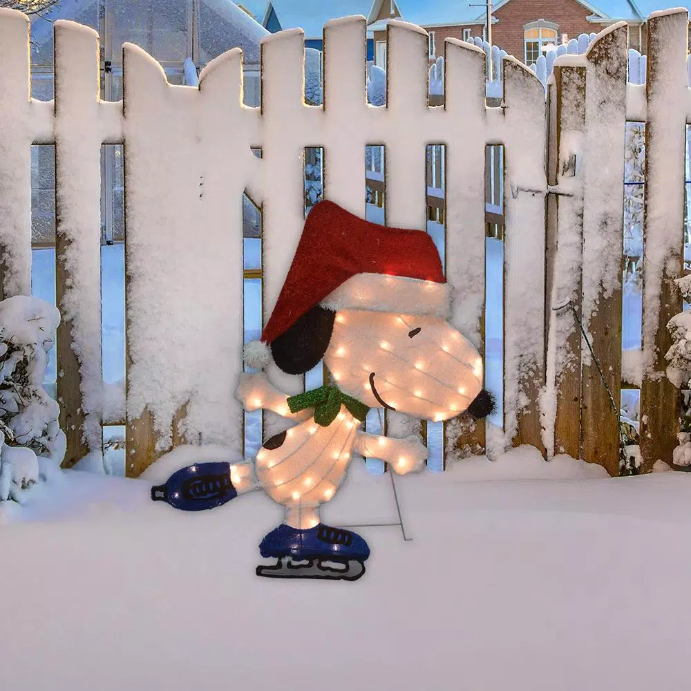 Peanuts 32 in. Peanuts Snoopy Skating 2D LED Pre-Lit Yard Art Christmas Decoration