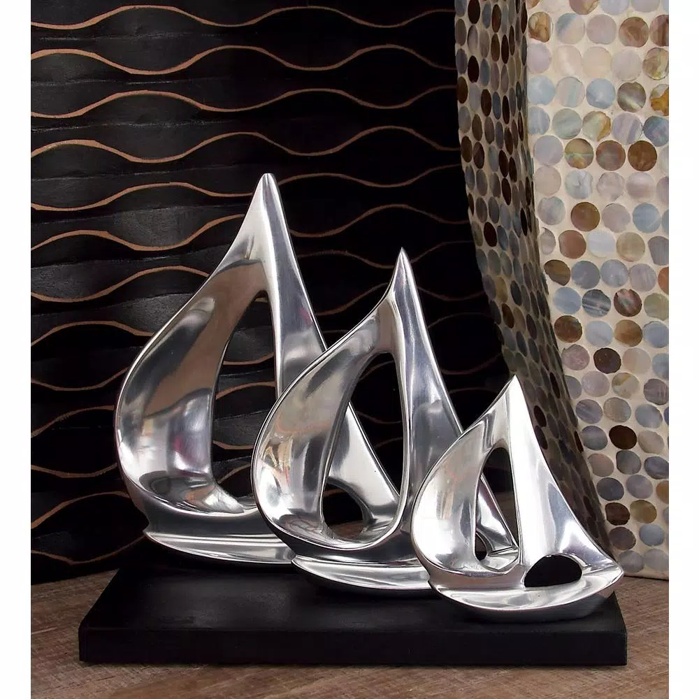 LITTON LANE 9 in. Stylized Sailboat Decorative Sculpture - Polished Silver Aluminum on Black Wood Base