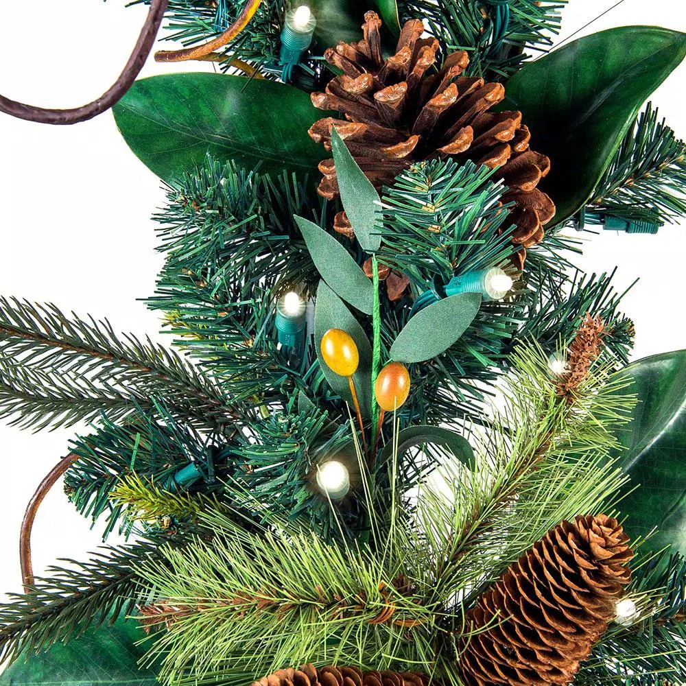 Village Lighting Company 9 ft. Pre-Lit LED Magnolia Leaf Garland with Pinecones and Warm White Lights