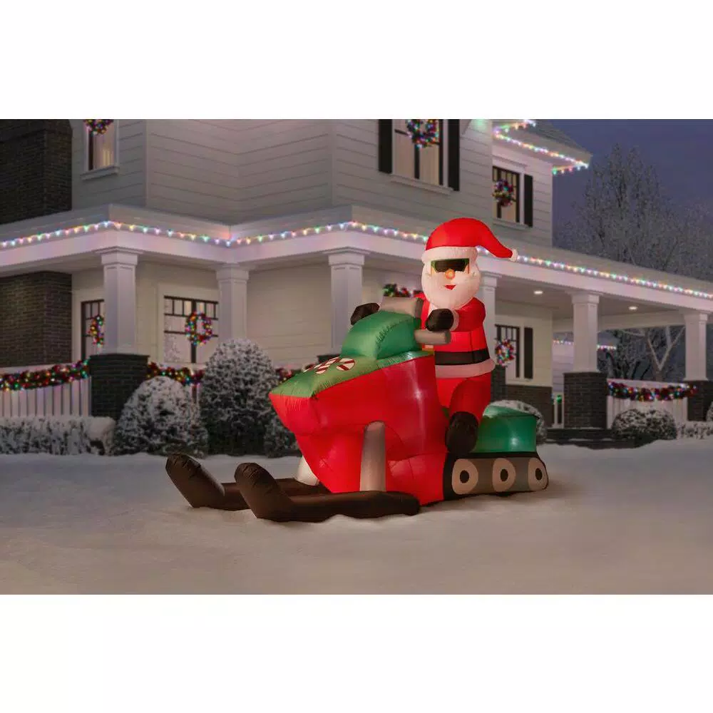 Unbranded 6 ft. Pre-Lit Inflatable Santa Driving Snowmobile Holiday Decoration