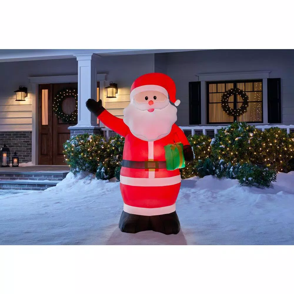 Home Accents Holiday 6.5 ft. Airblown Inflatable Santa with Present, LED Holiday Decoration
