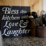 Unbranded Boulder Innovations 16 in. x 16 in. Bless This Kitchen With Love and Laughter Wood Wall Art thumbnail 1