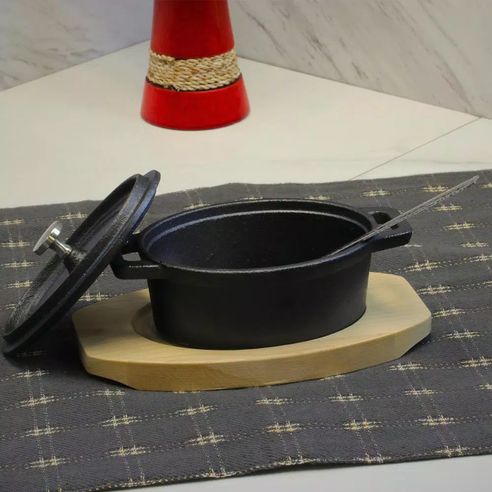 Gibson Home Campton 0.35 qt. Oval Cast Iron Mini Casserole Dish with Lid and Wood Base, Black