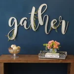 Stratton Home Decor Gather Metal Script Wall Sign, Large Handcrafted Pewter Decorative Art thumbnail 1