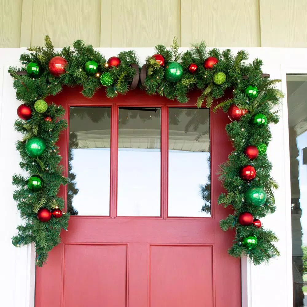 Village Lighting Company 9 ft. Pre-Lit LED Christmas Cheer Garland with Red and Green Ornaments