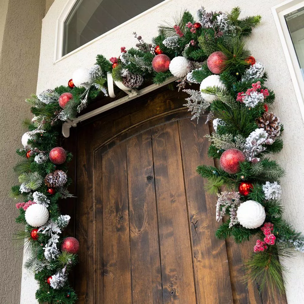 Village Lighting Company 9 ft. Frosted Wonderland Pre-Lit LED Christmas Garland, Red and White Candycane Theme