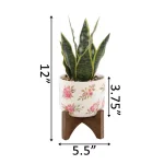 Flora Bunda 12 in. Faux Snake Plant in Floral White Ceramic Pot with Wood Stand thumbnail 2