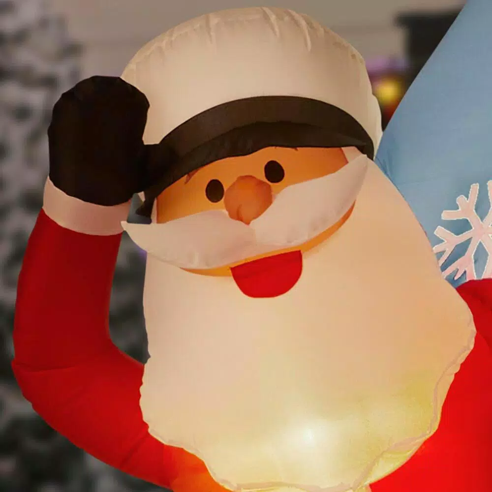 Home Accents Holiday 7 ft. Pre-Lit LED Inflatable Santa in Sailboat with Penguin Christmas Decoration