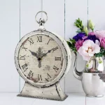 Stonebriar Collection Faith Round Tabletop Clock - 12.5 in. Rustic Ivory Metal Analog Clock with Cross thumbnail 2
