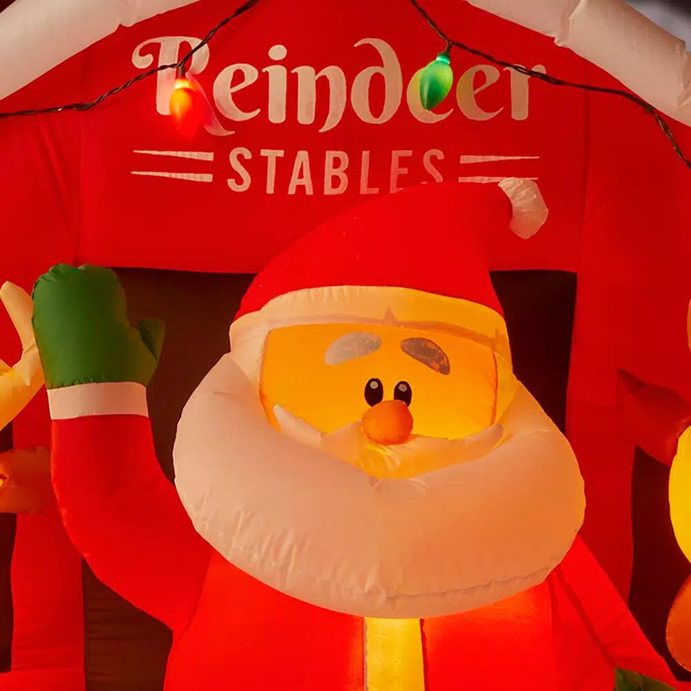 Home Accents Holiday 9 ft LED Inflatable Santa's Stable with Reindeer Holiday Decor