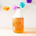 Cathy's Concepts 64 oz. Sugar Skull Glass Craft Beer Growler with Screw-Top Lid and Handle thumbnail 3